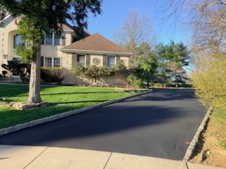 Same driveway jet-black after professional sealcoating